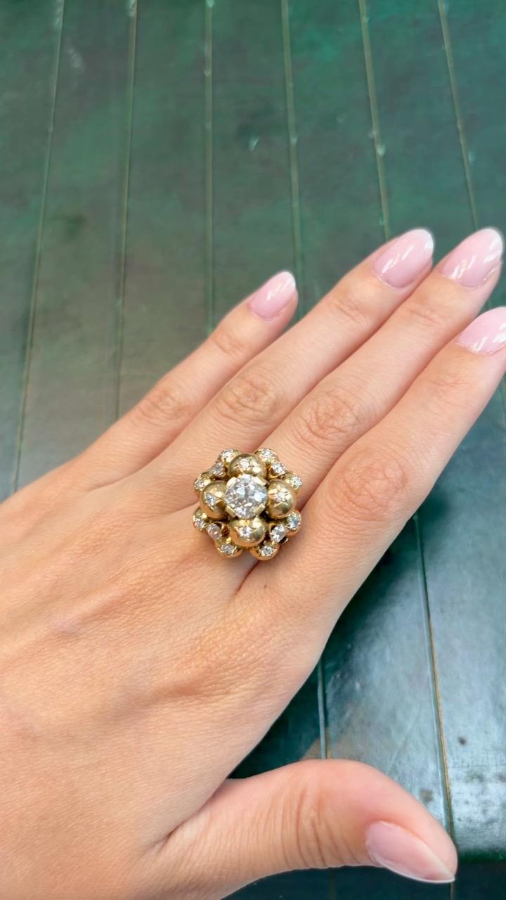 A 18K Yellow Gold ring composed of 12 balls star-set with old-cut diamonds