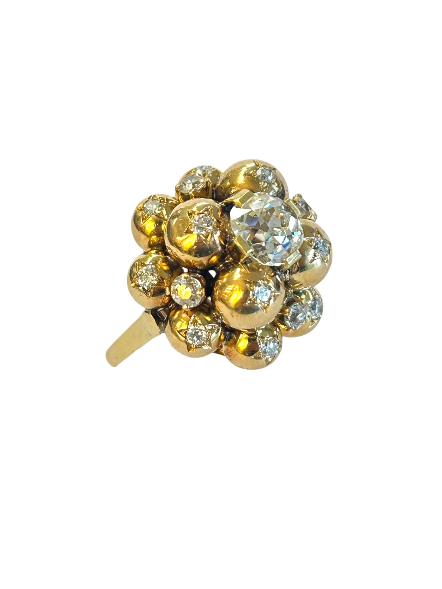 A 18K Yellow Gold ring composed of 12 balls star-set with old-cut diamonds