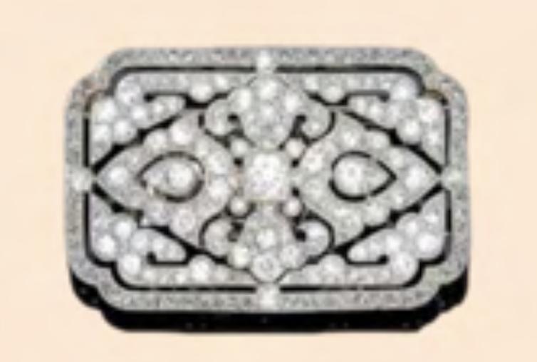 A brooch - pendant with an arabesque motif in 950 platinum set with 8x8 cuts