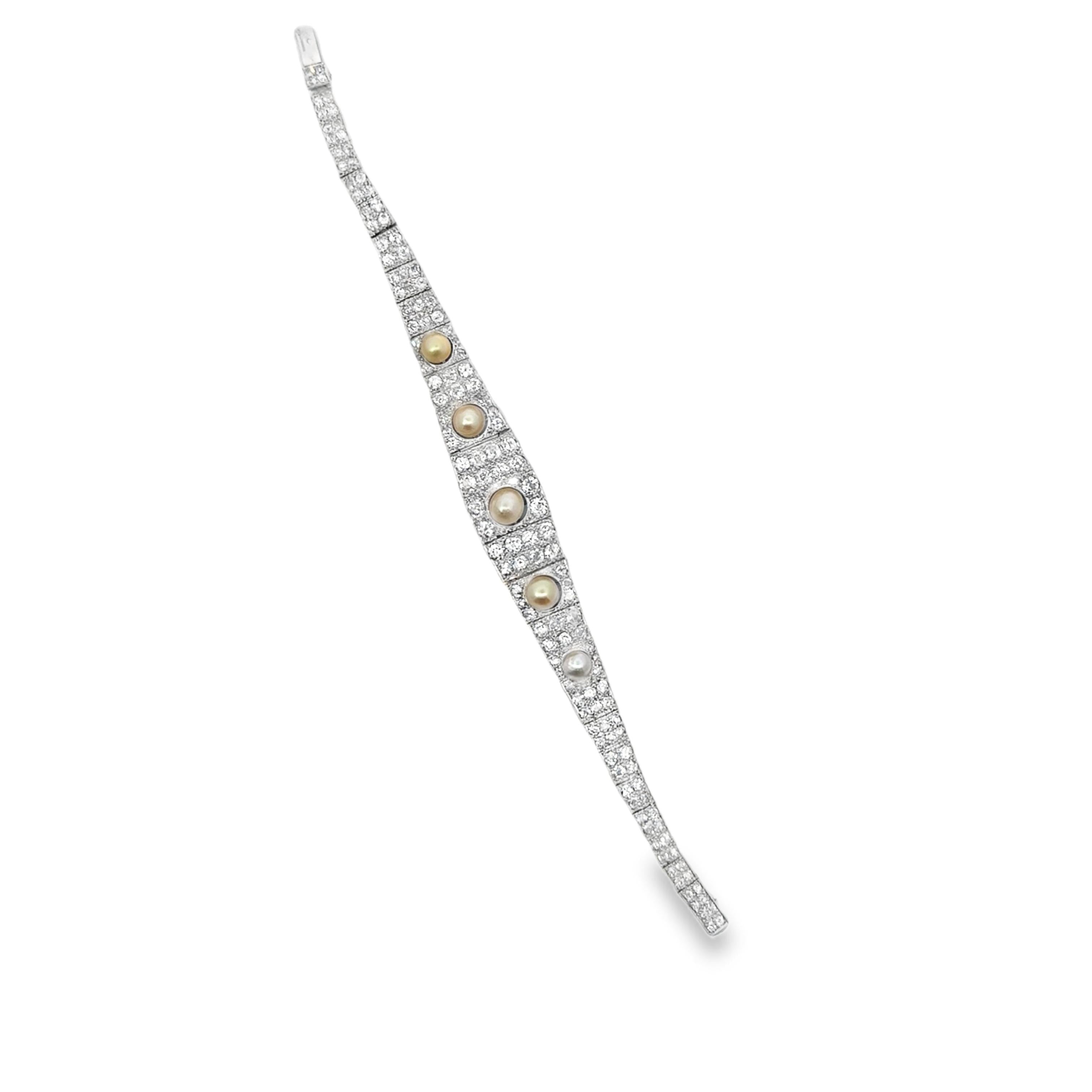 A platinum bracelet set with old cut diamonds approx. 9 cts and 5 pearls