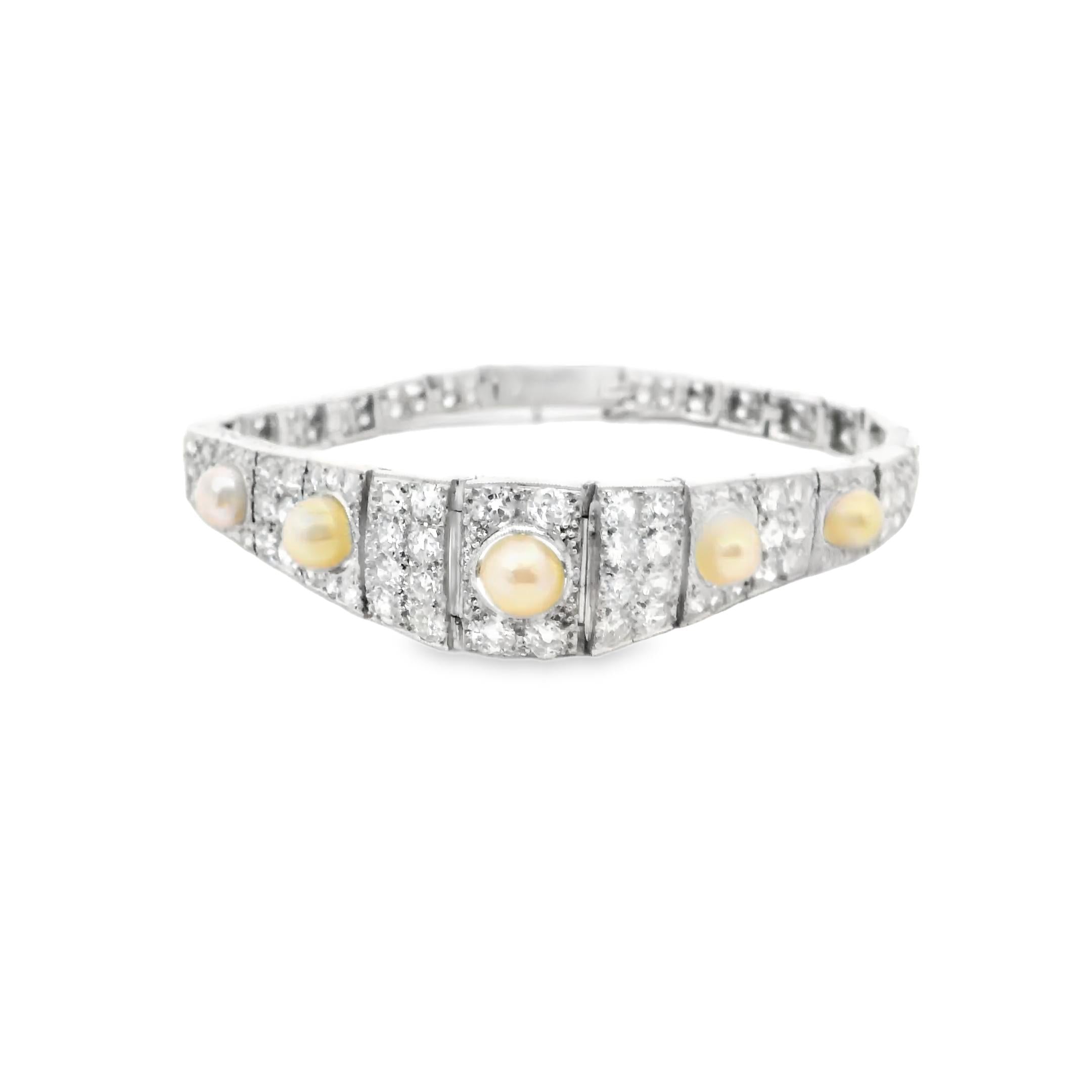 A platinum bracelet set with old cut diamonds approx. 9 cts and 5 pearls