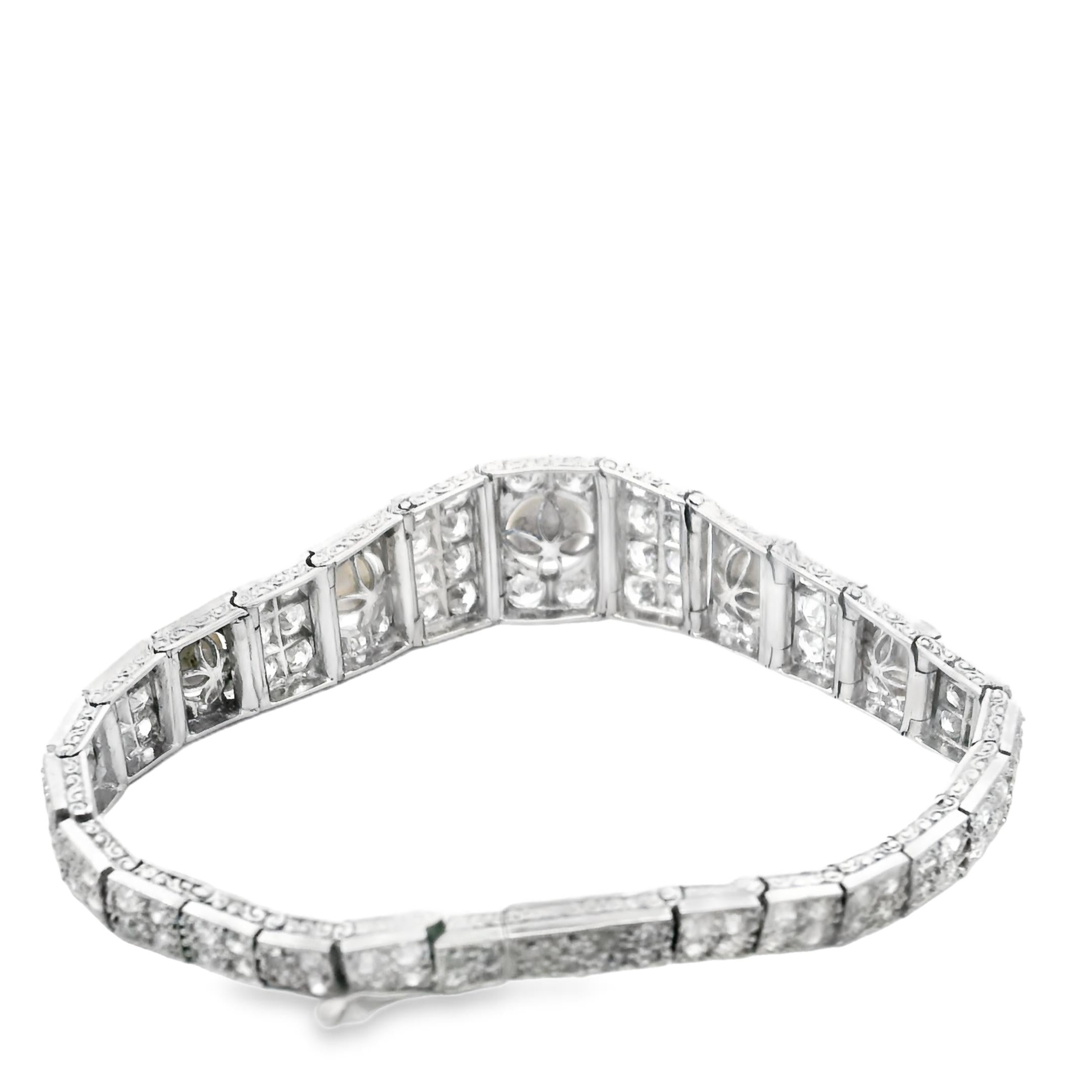 A platinum bracelet set with old cut diamonds approx. 9 cts and 5 pearls
