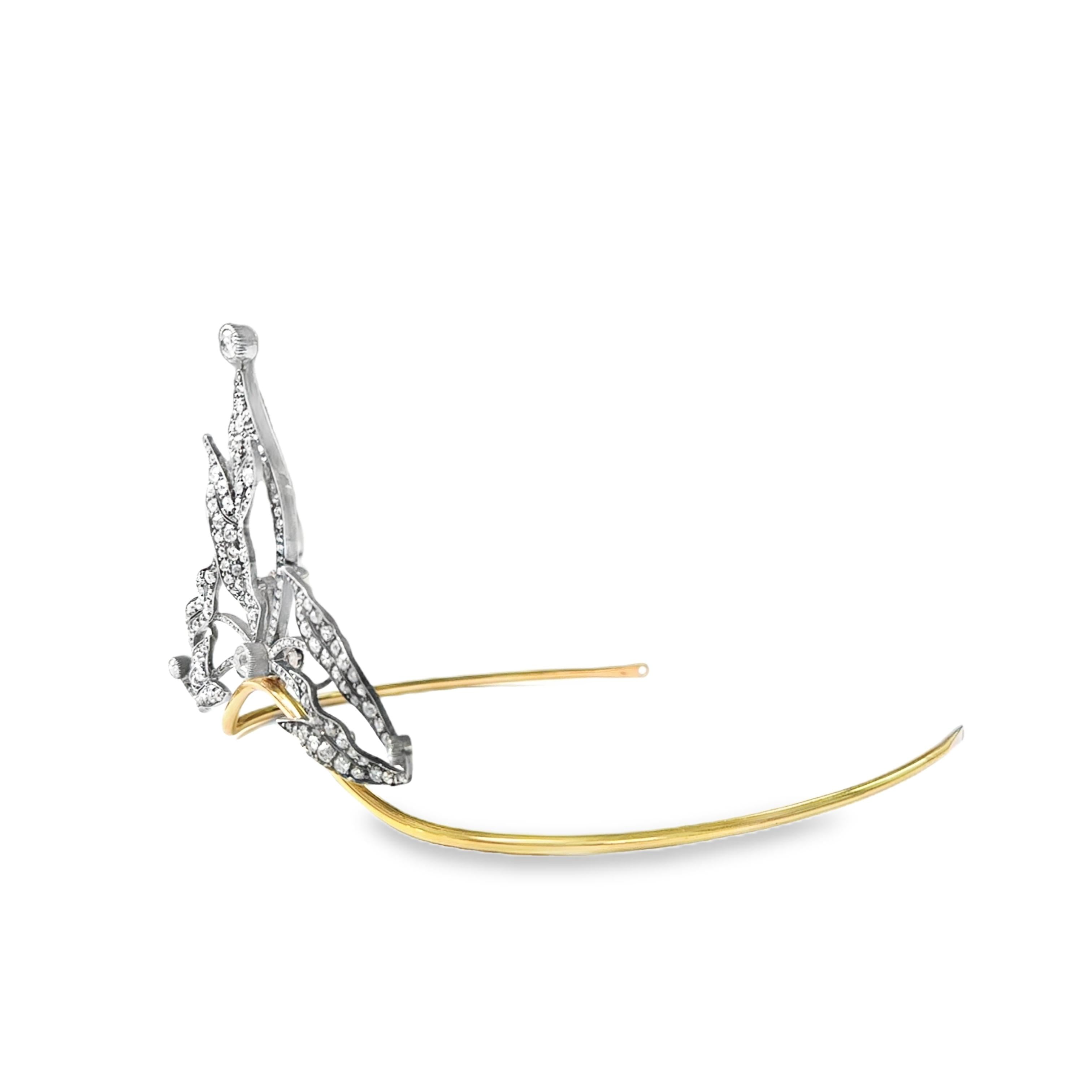 A tiara convertible into a brooch in yellow gold and silver set with diamonds.