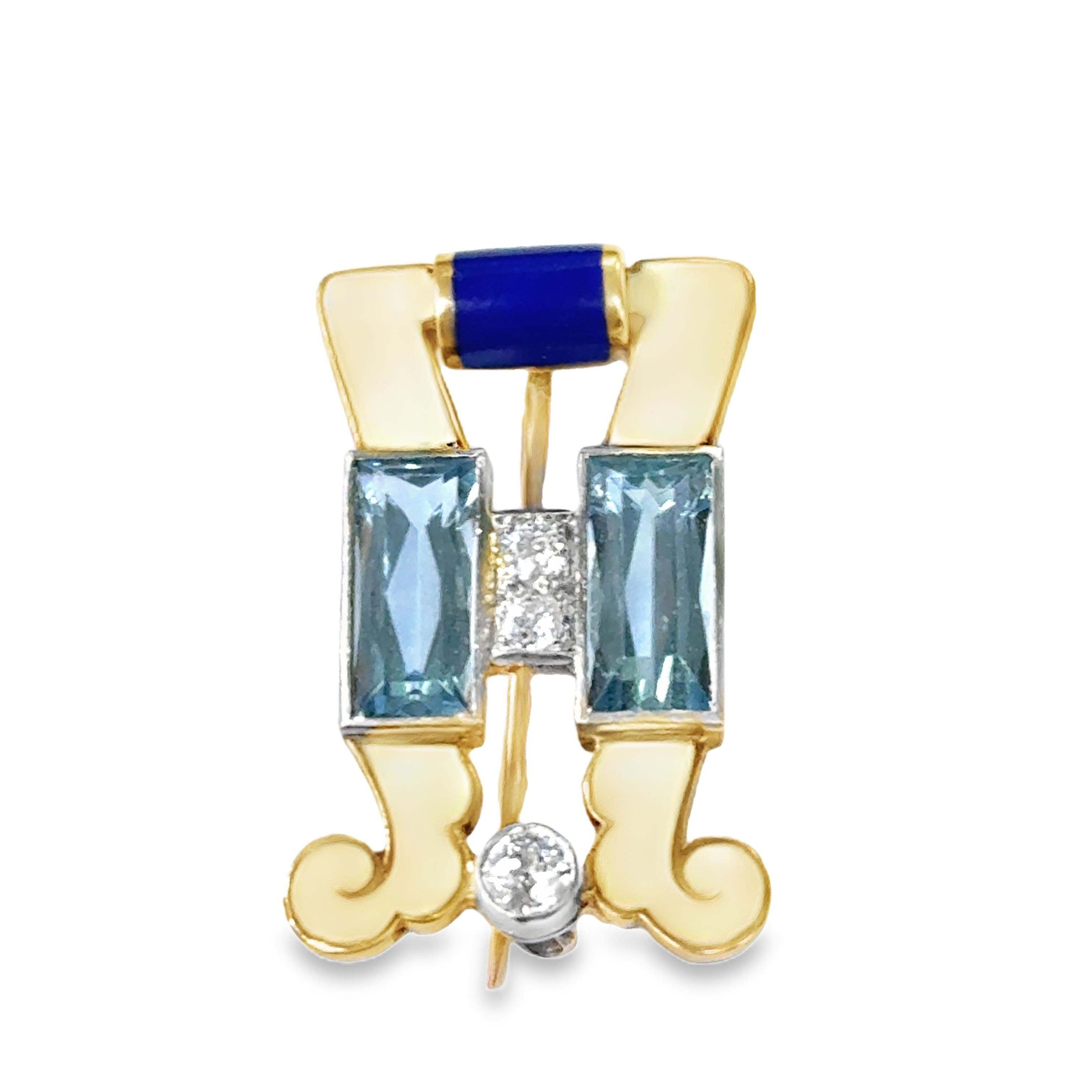 A gold and white and blue enamel brooch set with diamonds and aquamarine.