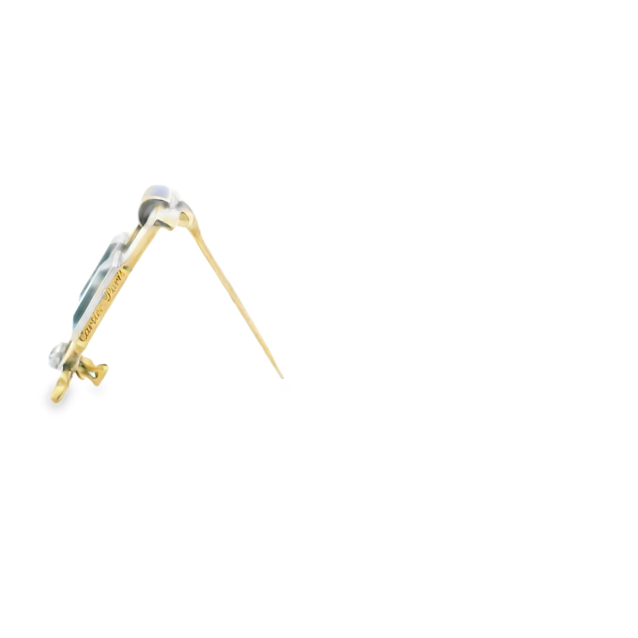 A gold and white and blue enamel brooch set with diamonds and aquamarine.