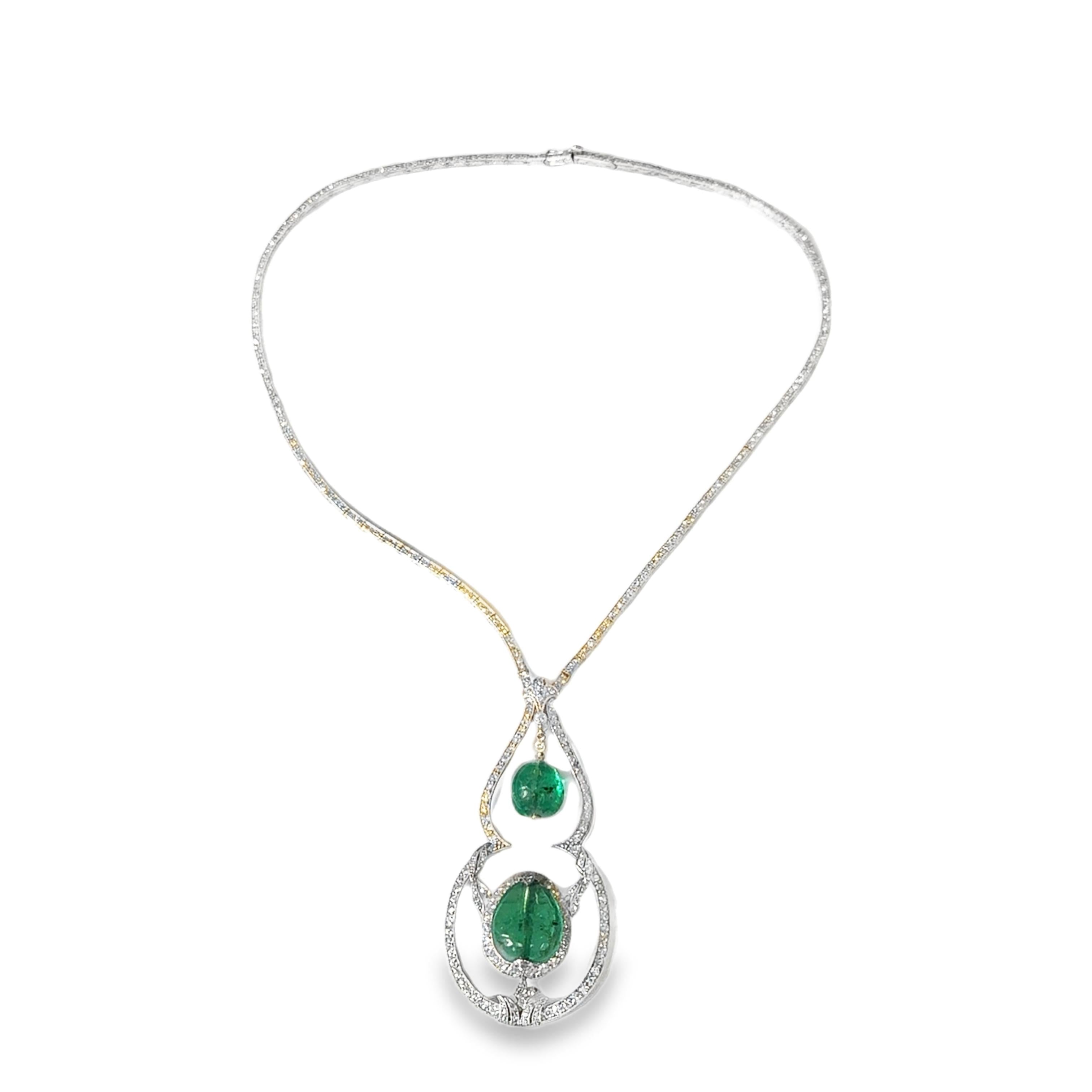 A 18k white gold necklace set with 8/8 cut diamonds set with two emerald drops w