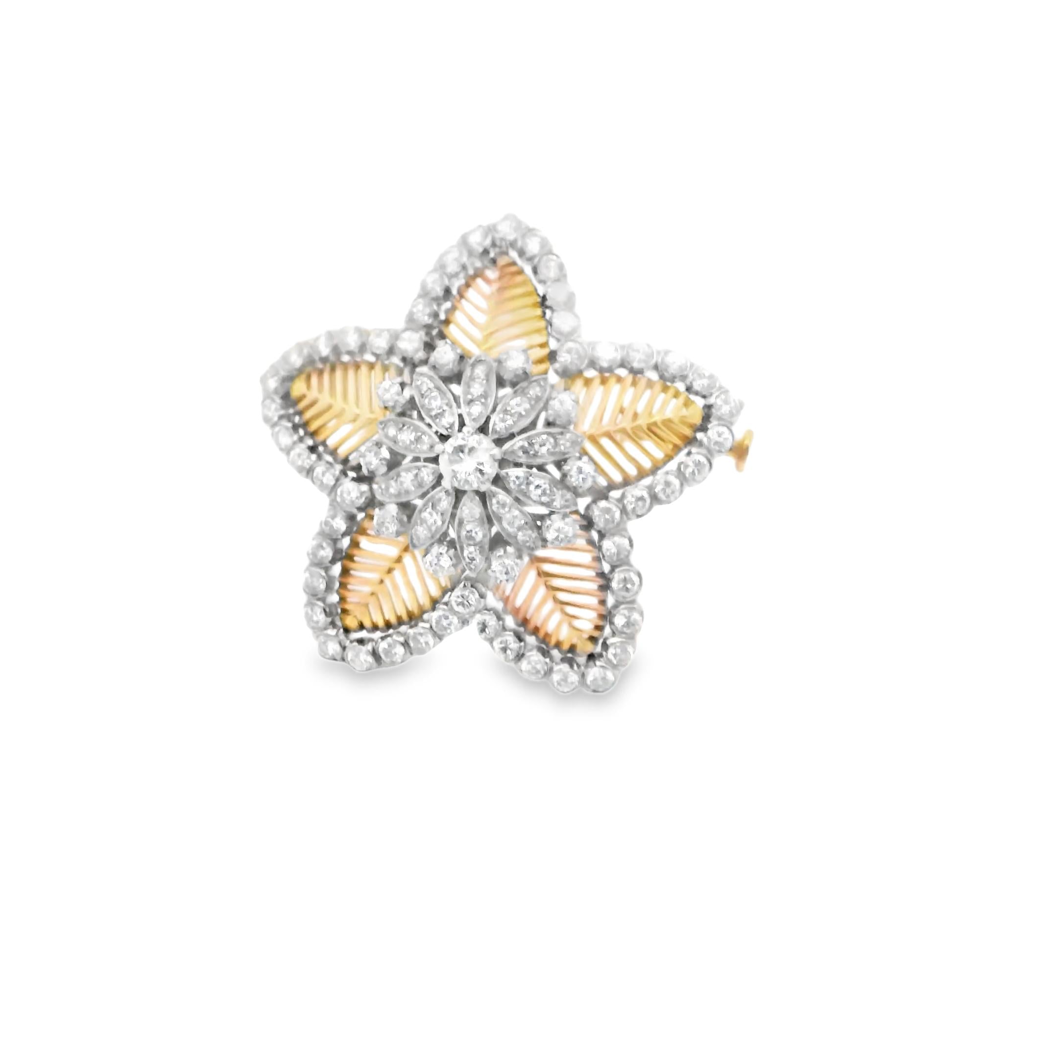 A brooch in gold, platinum and diamond By Cuzi