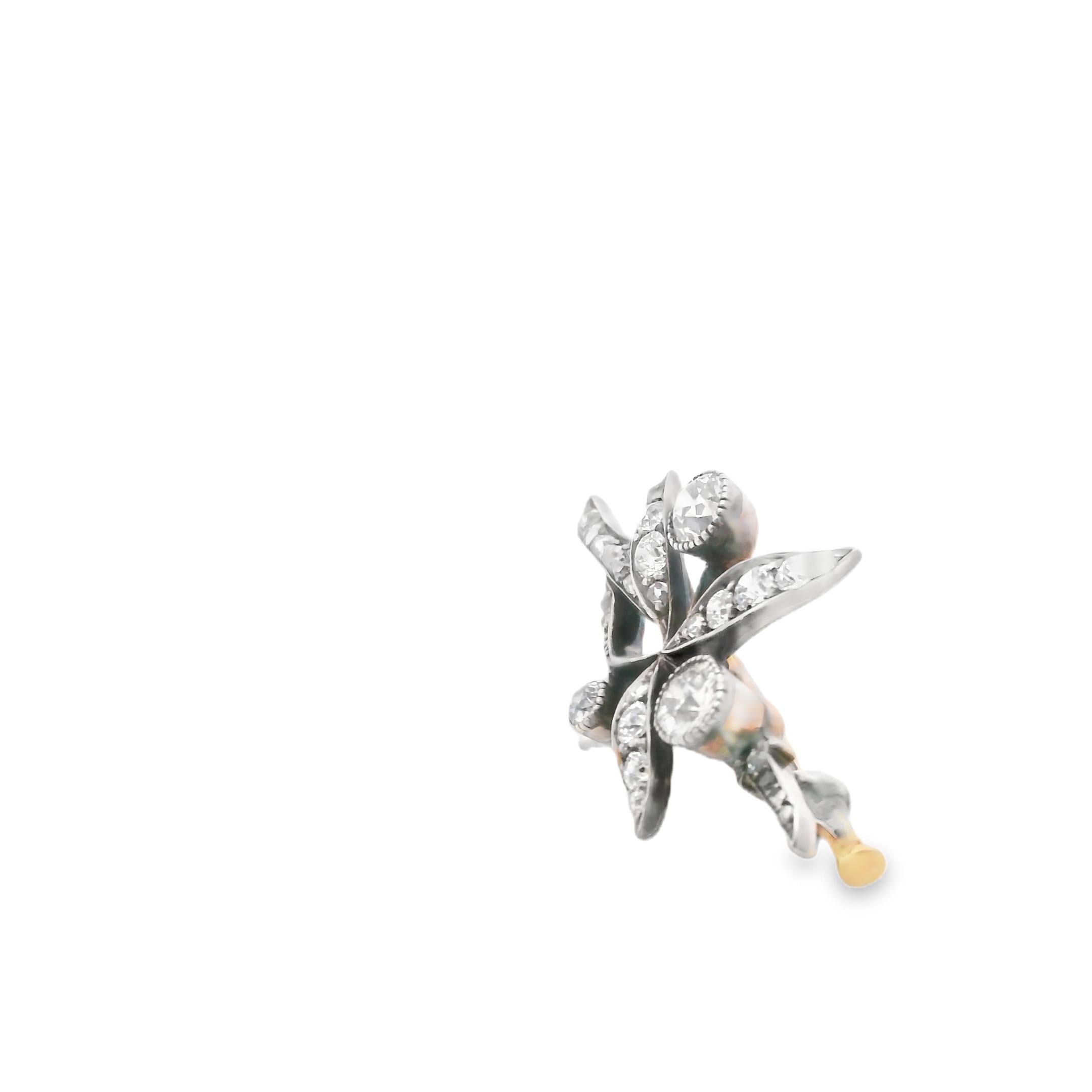 An antique brooch in gold, silver and diamond