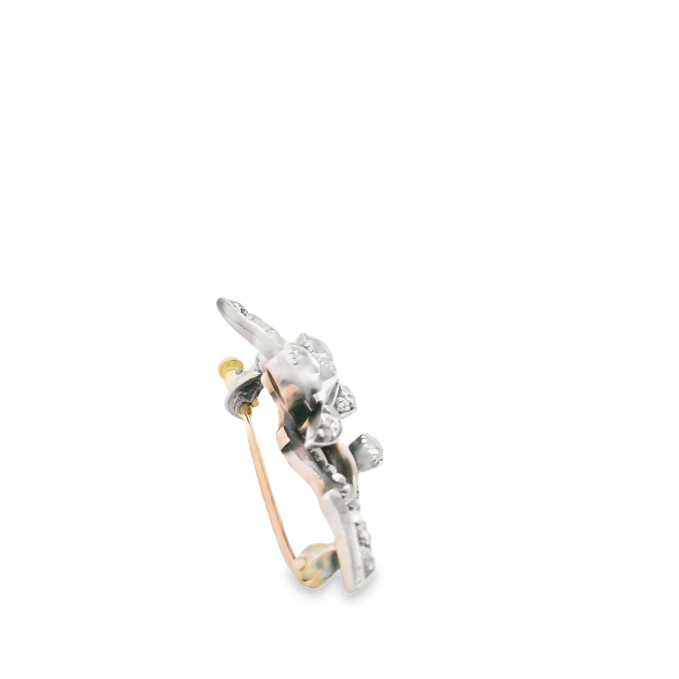 An antique brooch in gold, silver and diamond