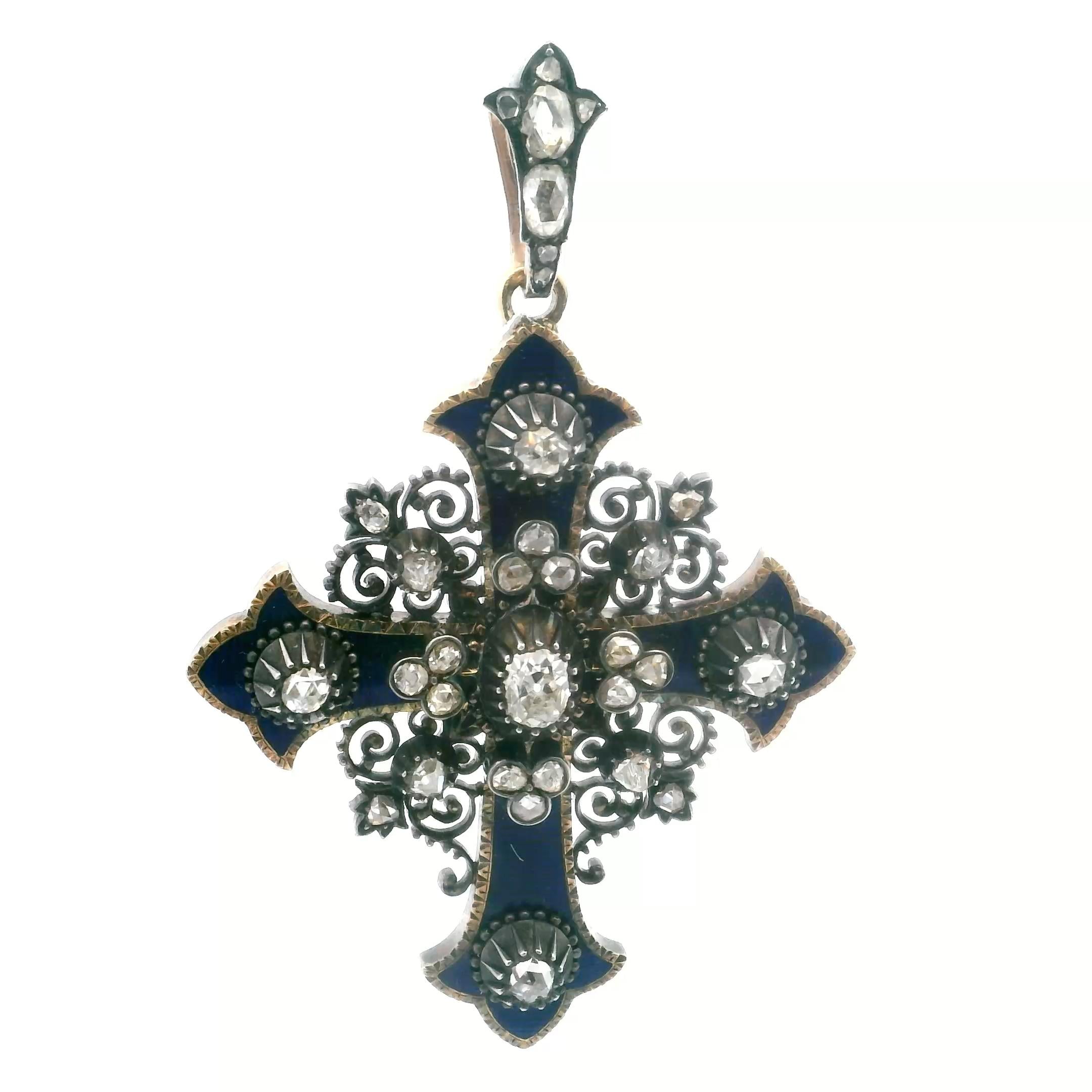 An antique cross in gold, silver, enamel and diamond.