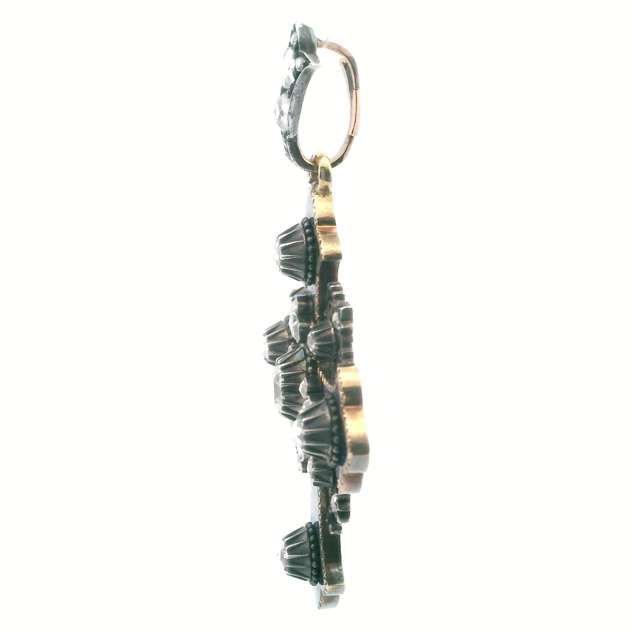 An antique cross in gold, silver, enamel and diamond.
