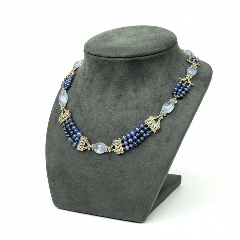 A sapphire and diamond bead necklace.