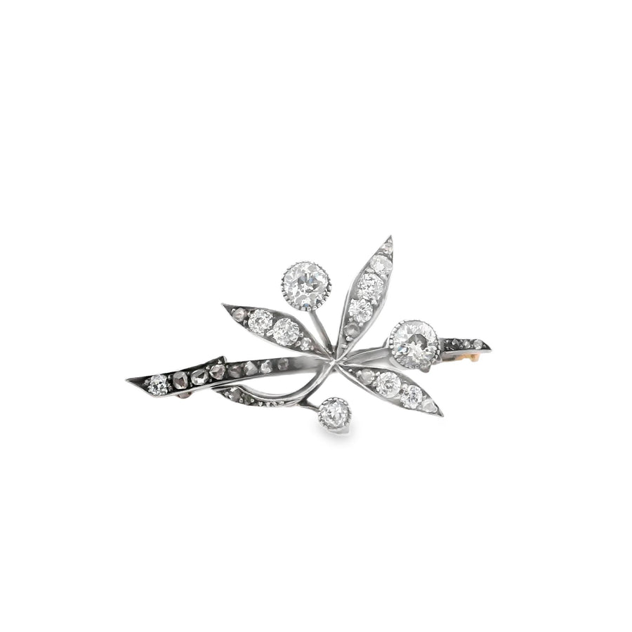 An antique brooch in gold, silver and diamond